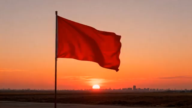 夕阳下飘扬的红色旗帜1031#横屏 