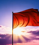 夕阳下飘扬的红色旗帜379#横屏 