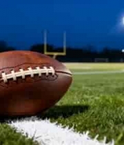  橄榄球置于体育场草坪上1875#横屏 	 