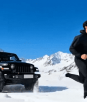 雪山中男子跑步与黑色越野车画面576#横屏 